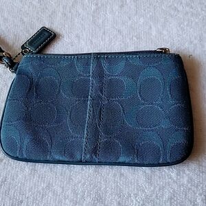 Coach wristlet color teal.